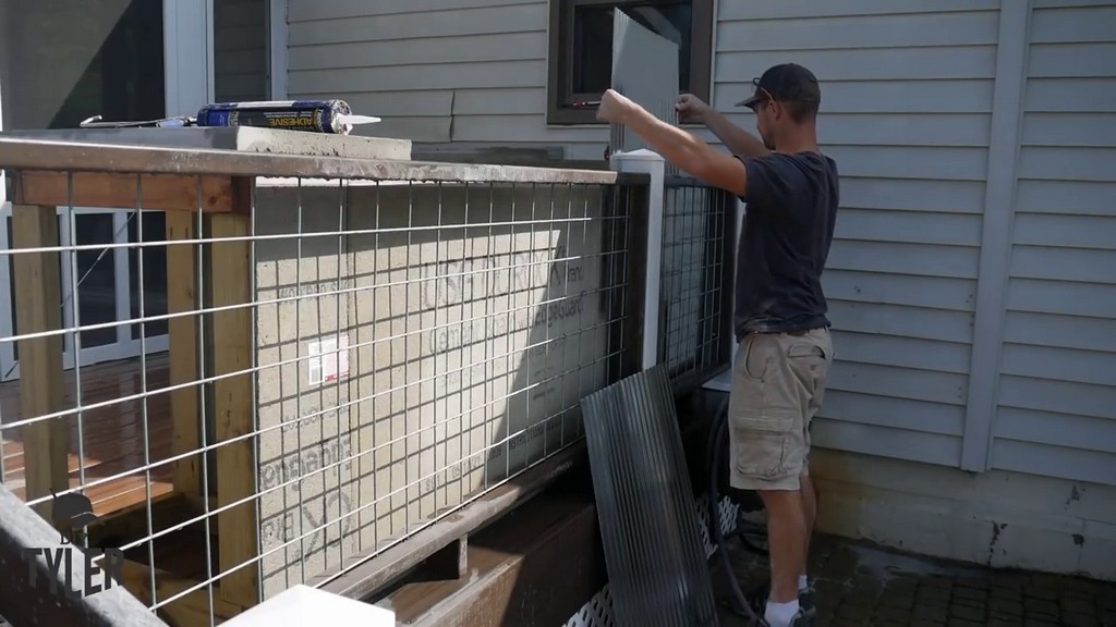 inserting galvanized steel panels behind kitchen frame