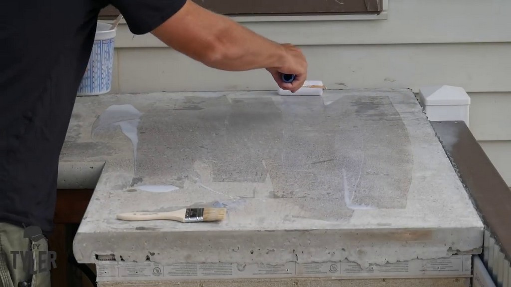 applying concrete countertop coating with roller