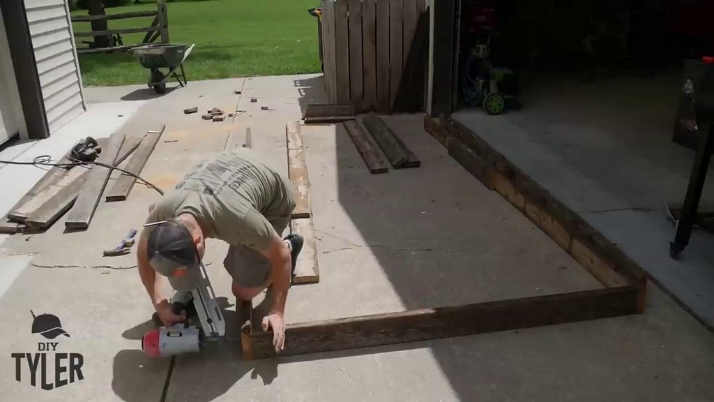 nailing together base frame for DIY chicken tractor