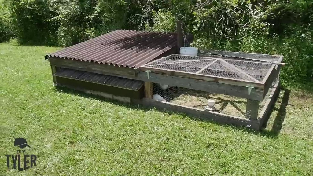 completed DIY chicken tractor filled with DIY homestead meat chickens