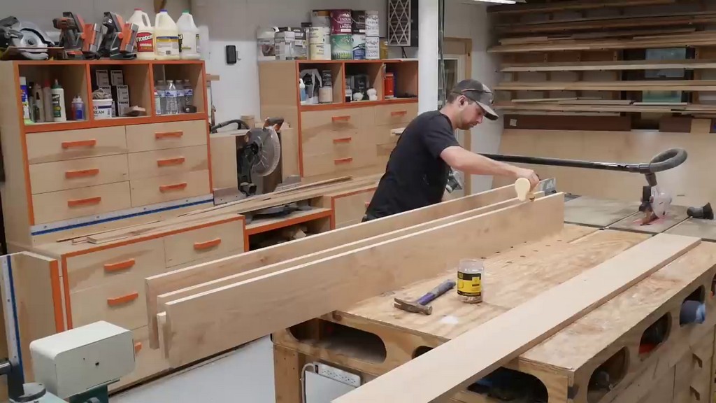 applying wood glue to hickory boards for kitchen tabletop