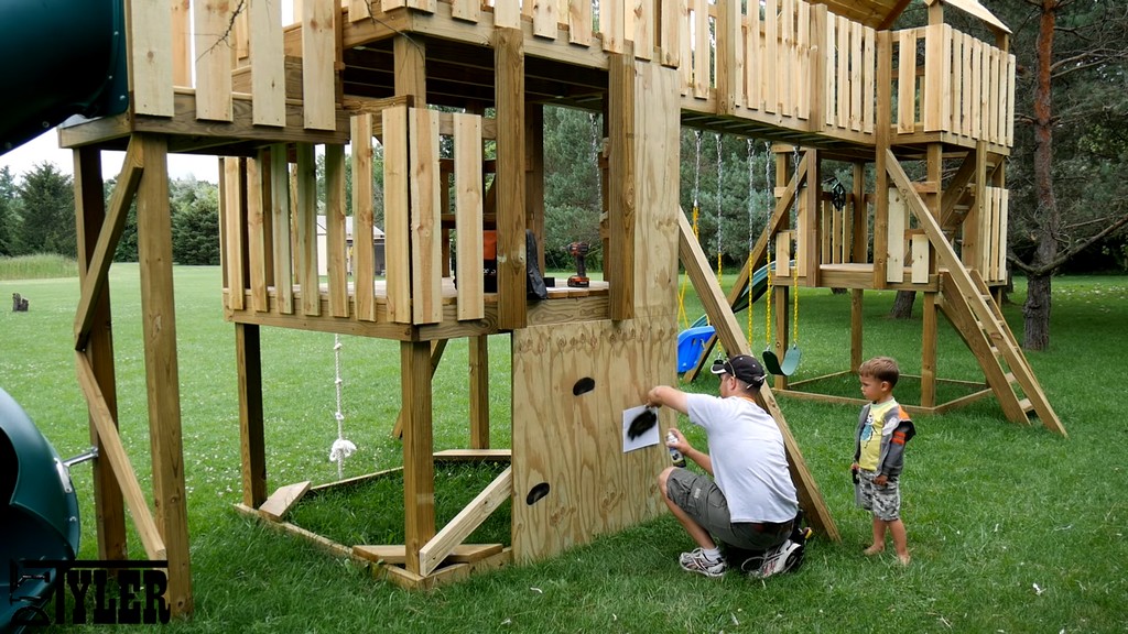 spray-painting shapes onto diy climbing wall