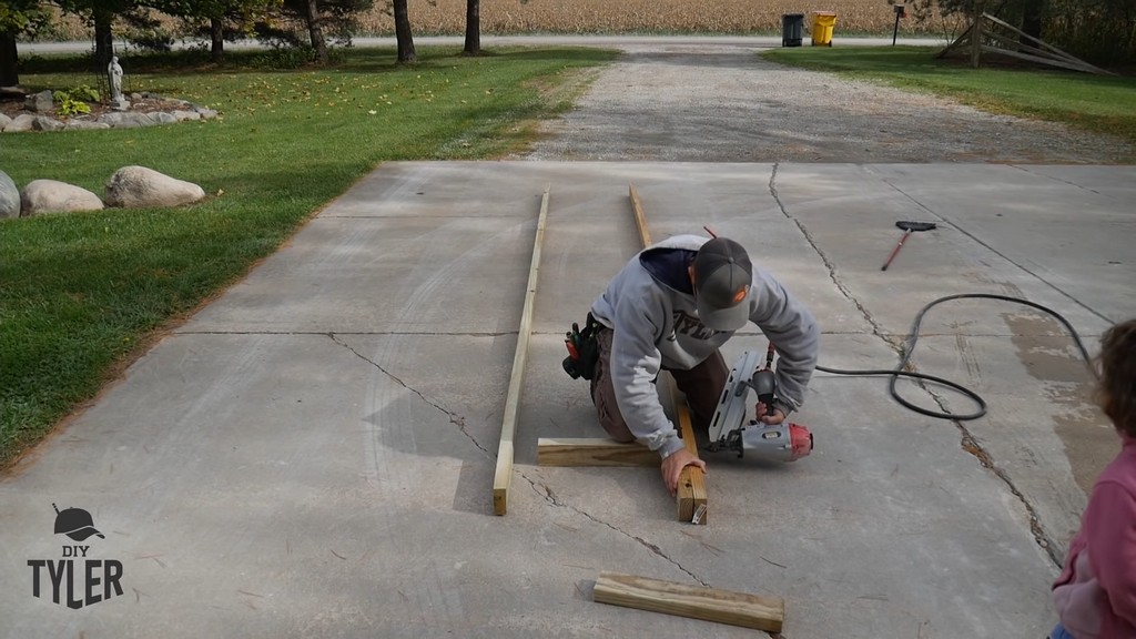 nailing together ladder pieces for diy deer stand
