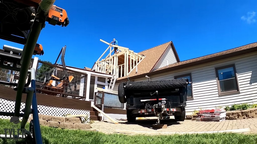 man assembling rafters for diy dormer addition