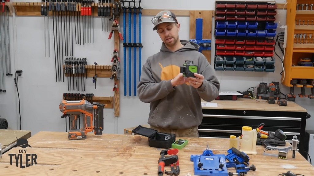 man holding up Huepar laser level