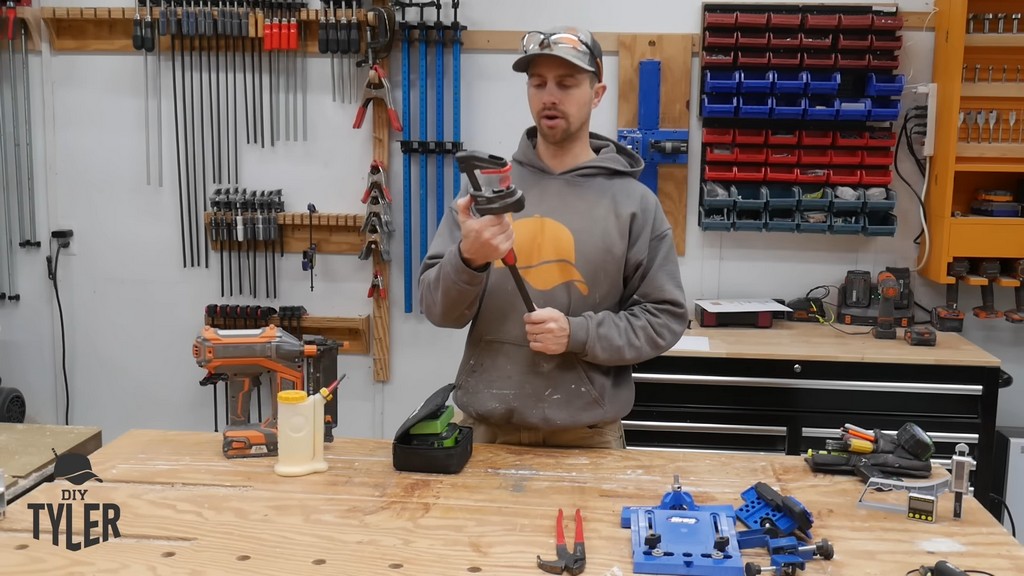 man holding up large BESSEY clamp