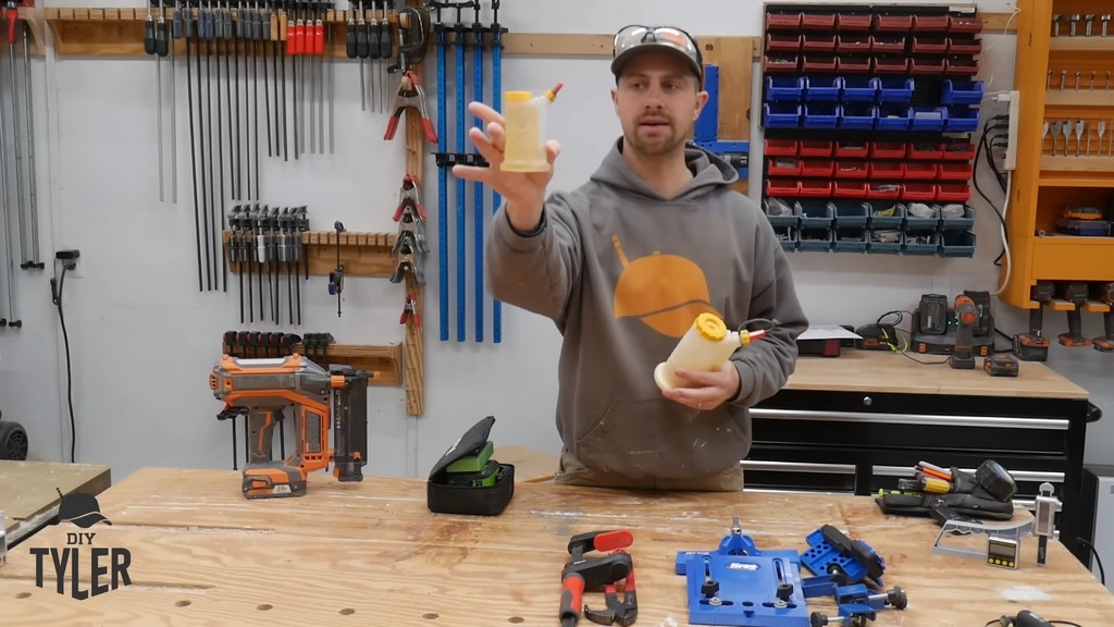 man holding up smaller FastCap Glue Bot