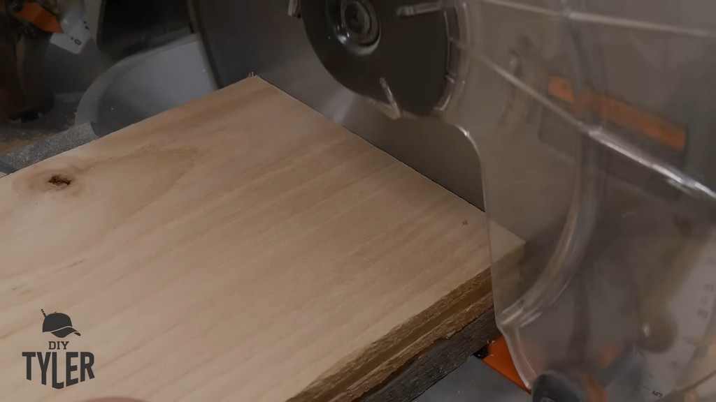 miter saw cutting ash wood board