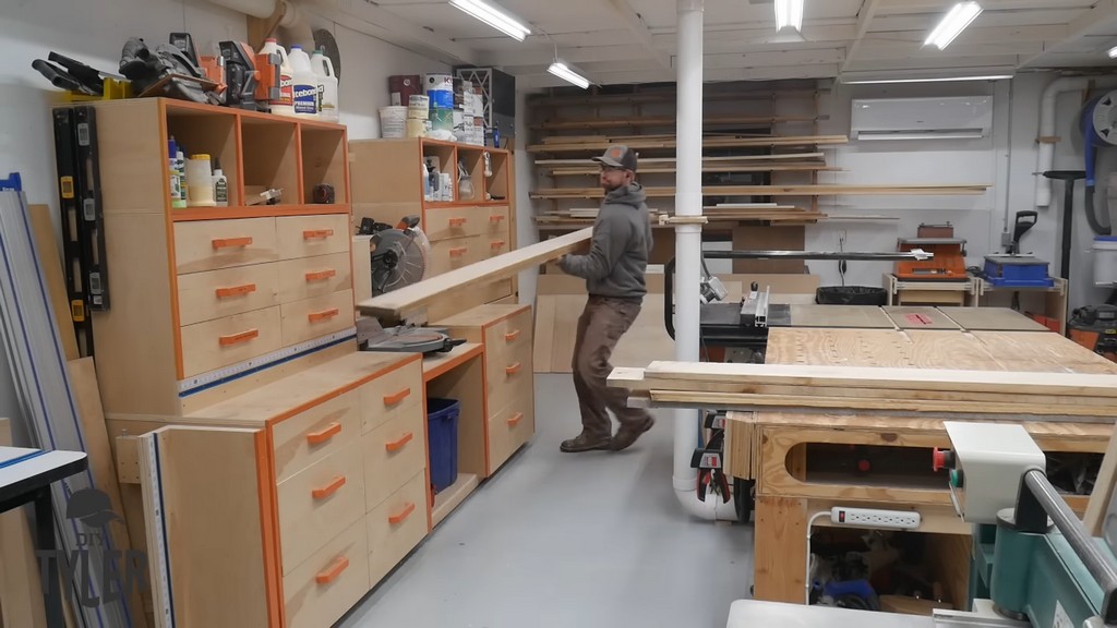 man cutting ash wood boards with miter saw