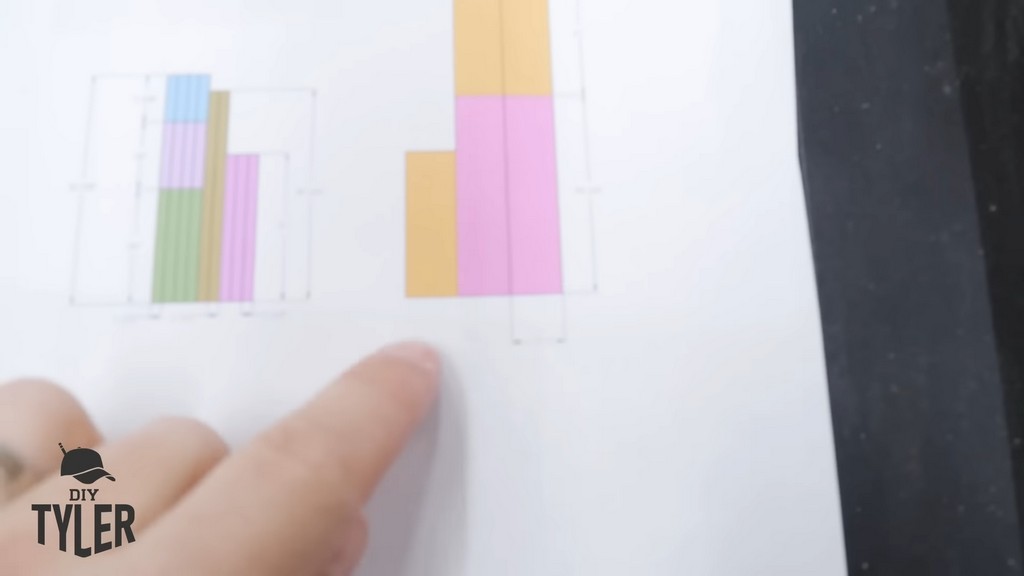 man pointing to plans for diy functional bathroom shelf