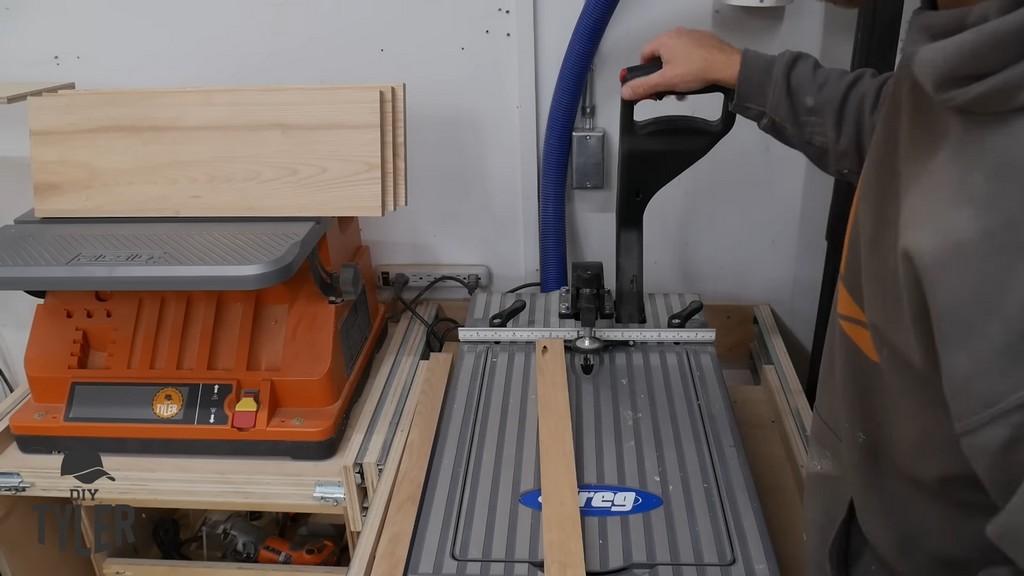 man adding pocket holes to board for diy functional bathroom shelf