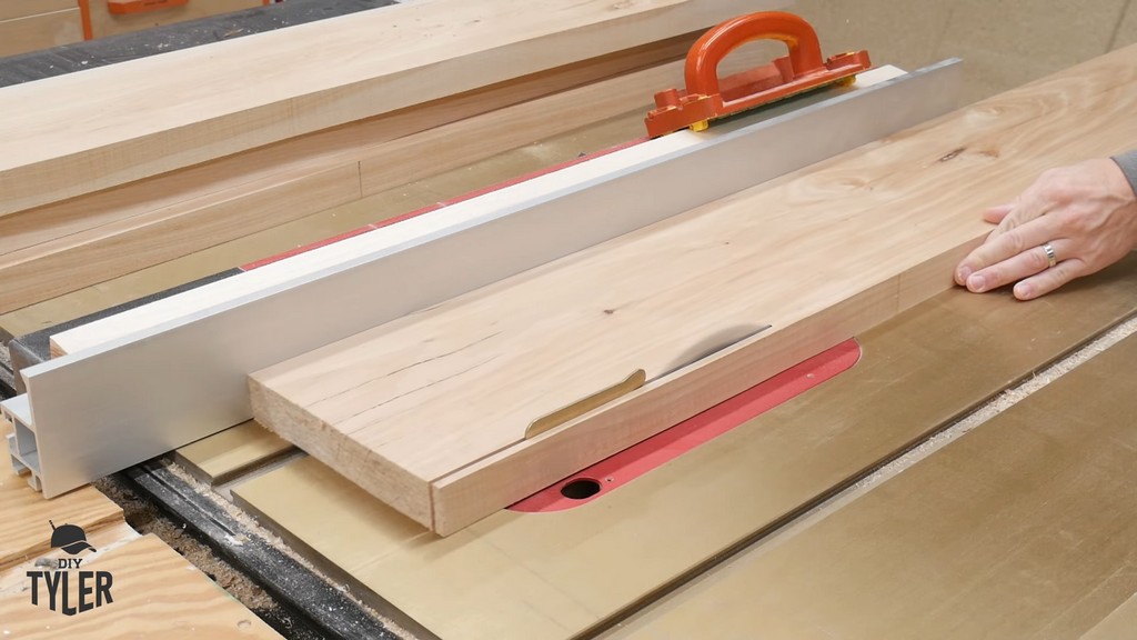 man running hickory board through table saw for DIY round coffee table