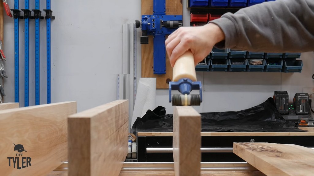 man applying Titebond II wood glue to hickory boards