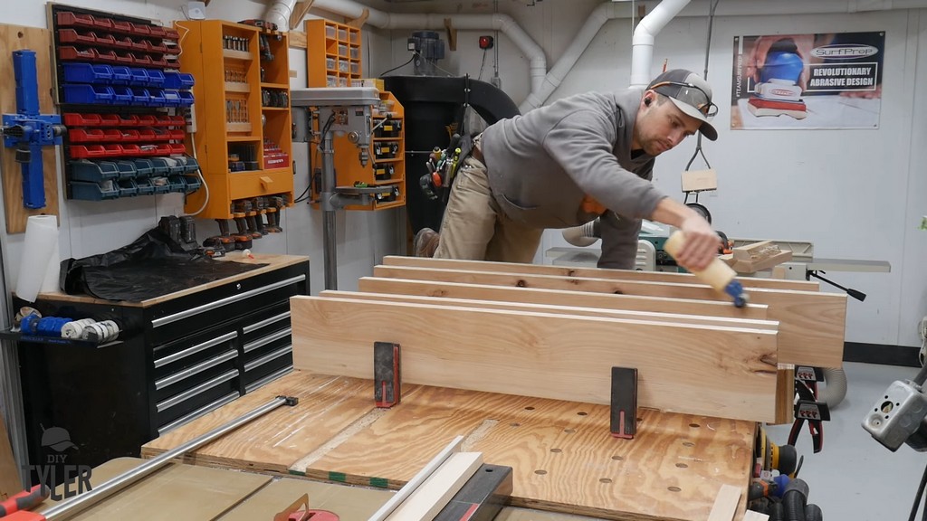 man applying Titebond II wood glue to hickory boards