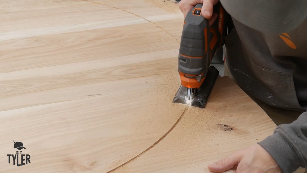 man cutting off excess hickory wood using jigsaw