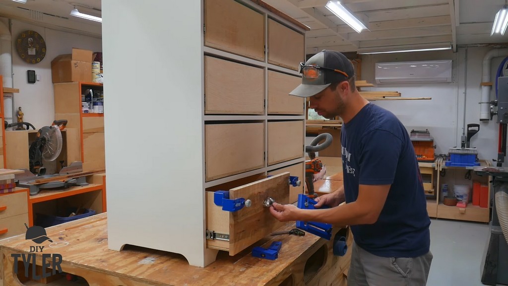 man demonstrating spacing for drawer front handle