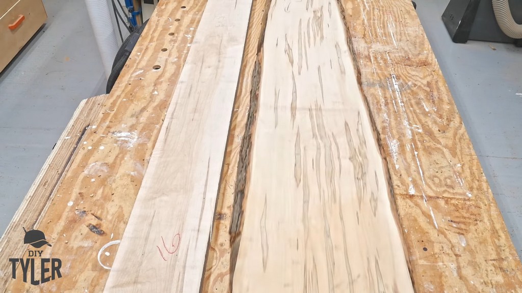 maple wood slabs resting on workshop table