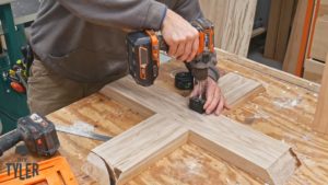 man drilling dowel hole with Rockler jig