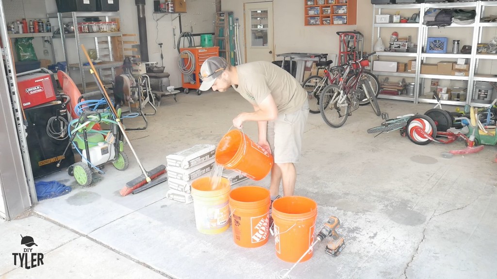 man pouring water into bucket for DIY concrete mix