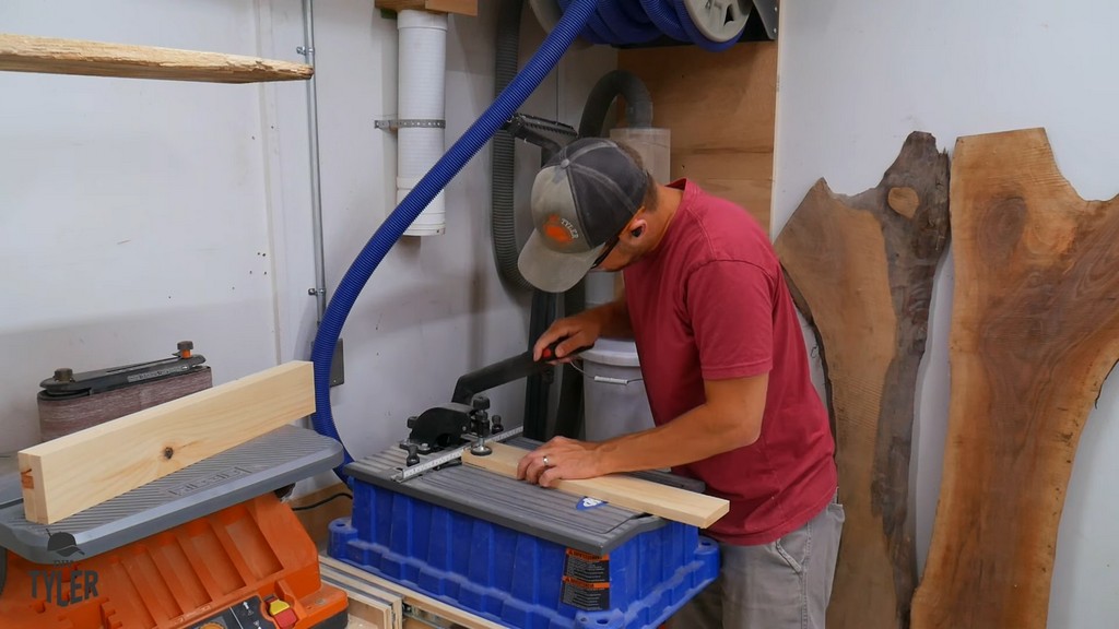 man using Kreg pocket hole jig on piece of pine board