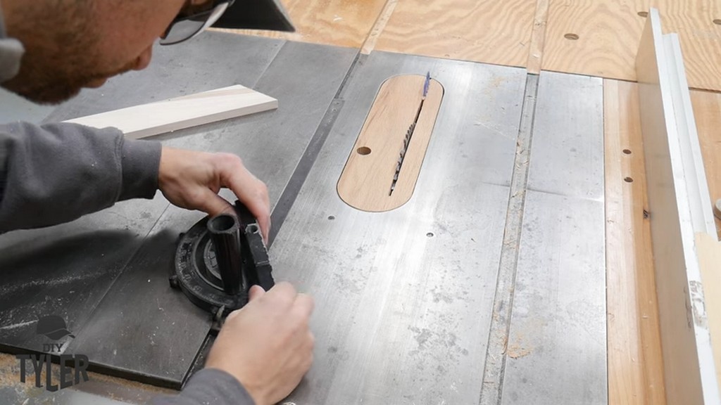 man measuring miter gauge for use with table saw