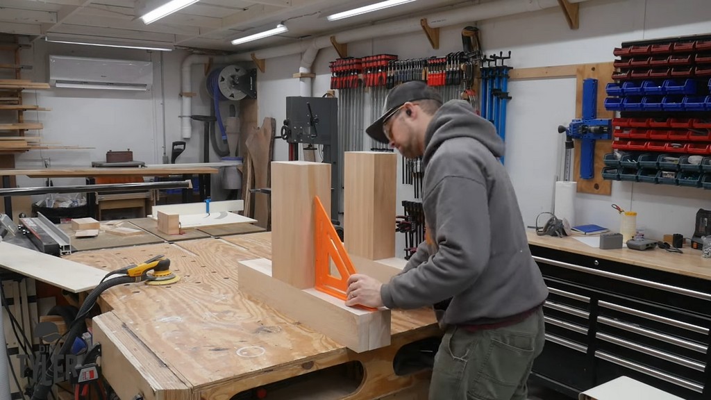 man checking hard maple wood pieces for square