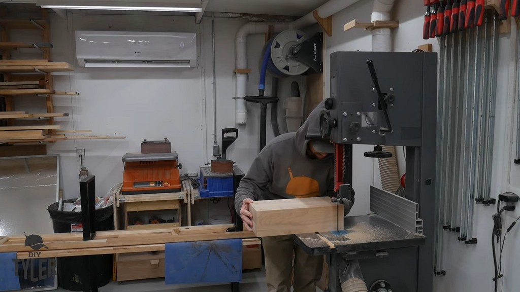 man running hard maple wood through bandsaw