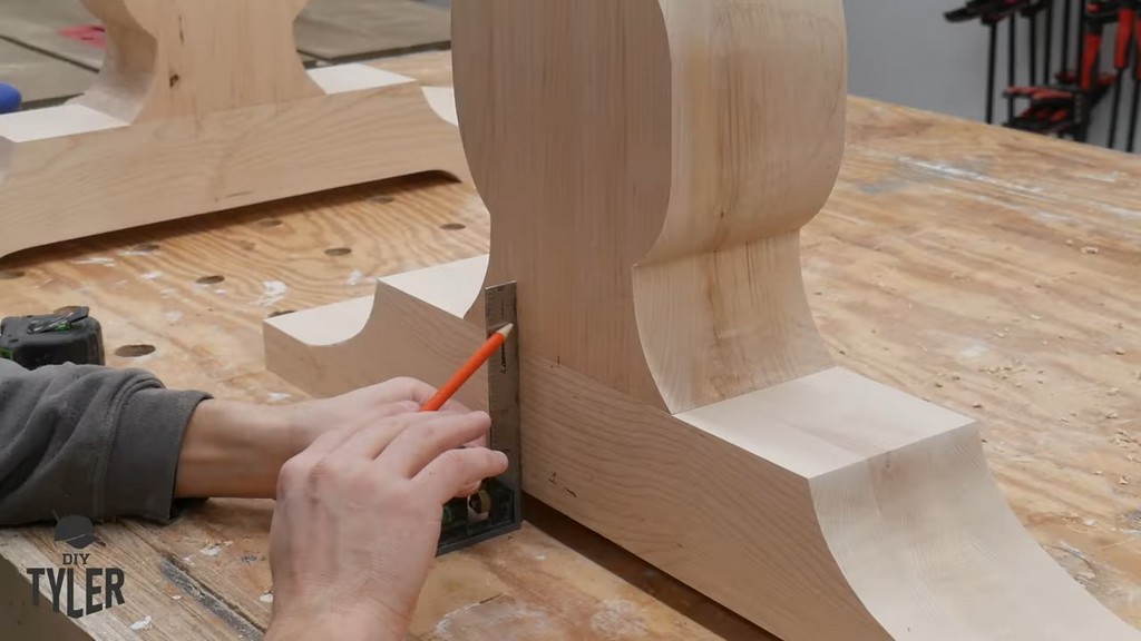 man measuring for dowel holes in pedestal piece