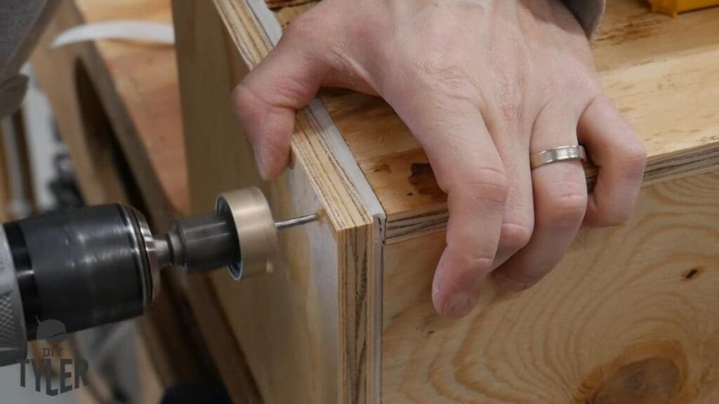 man fastening end of steam box into place