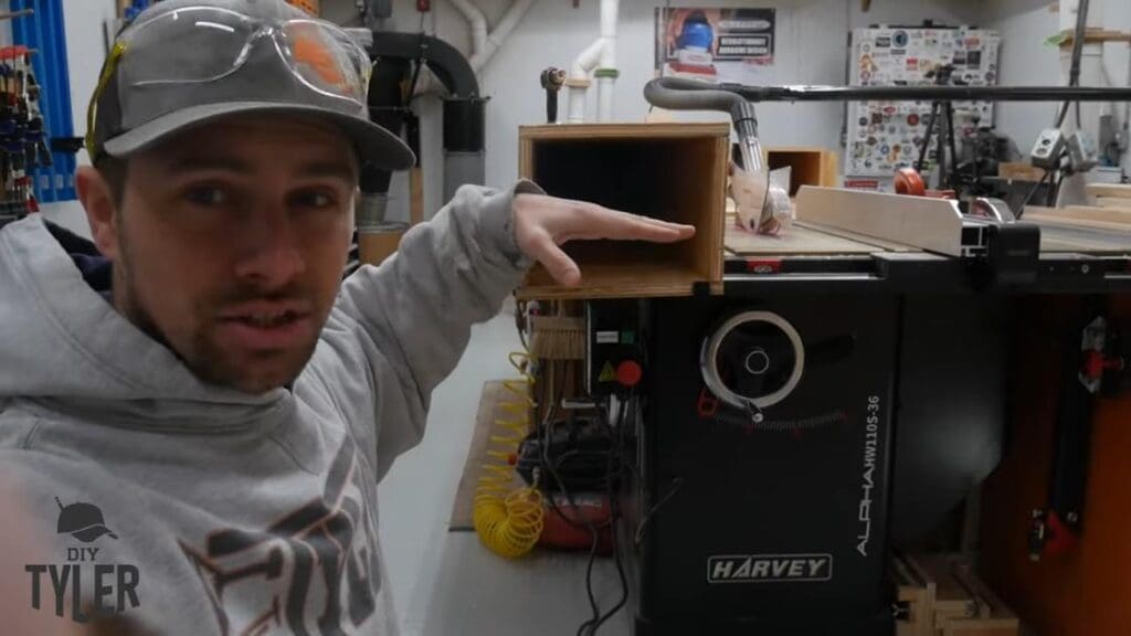 man gesturing halfway point of steam box for steam bending wood