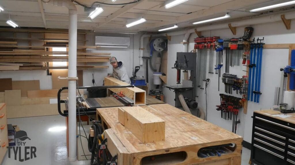 man running steam box through table saw
