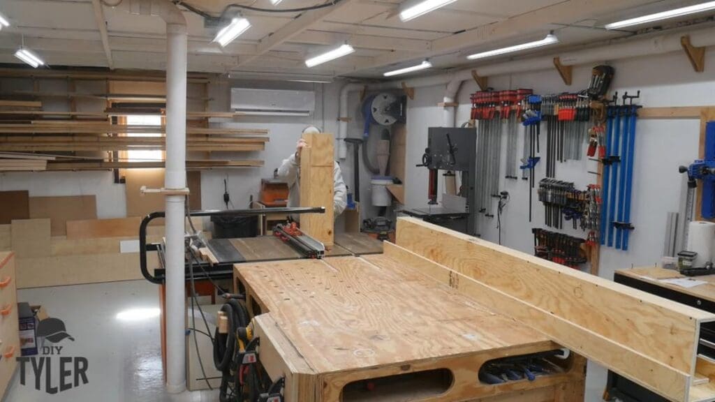 man running steam box through table saw