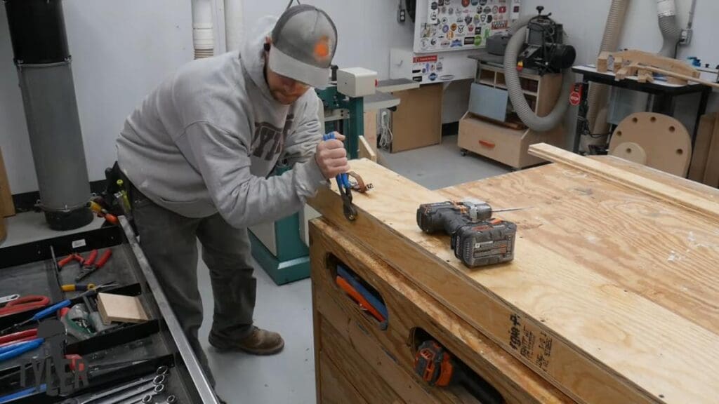 man tightening bolt for closing door to steam box