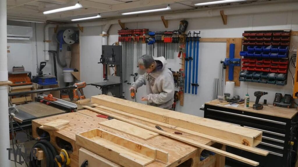 man fastening pieces of steam box