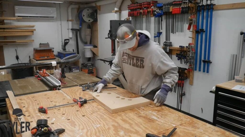 man preparing mold for bending steam-treated wood