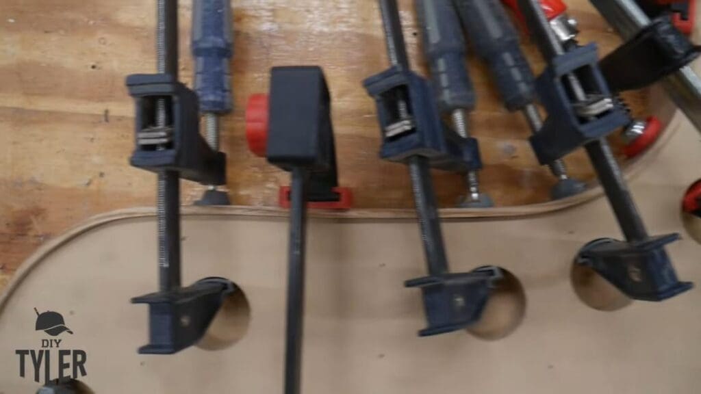 f-clamps holding bent steam-treated wood onto mold